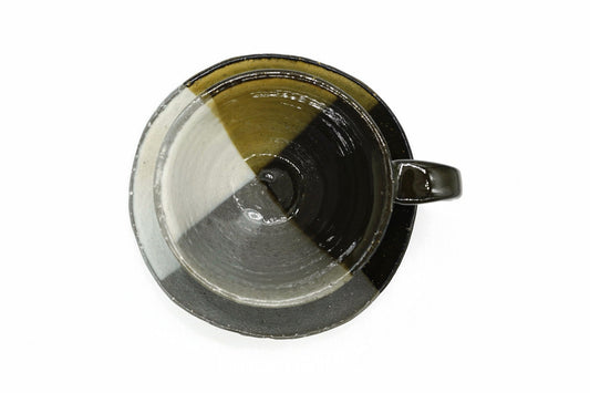 Kiame Yunomi from above, the three glazes continuing inside the cup and across the saucer