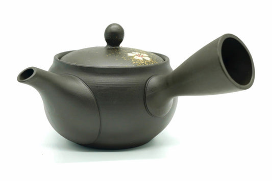 Nadeshiko Kyusu seen from the spout side, gold flecks and a flower on the lid