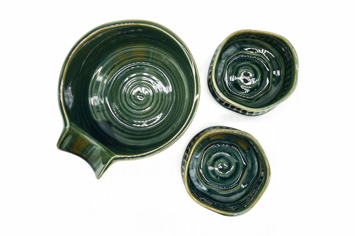 Oribe Japanese Tea Set from above, the spouted bowl with concentric rings inside and the two cups with a spiral at the centre