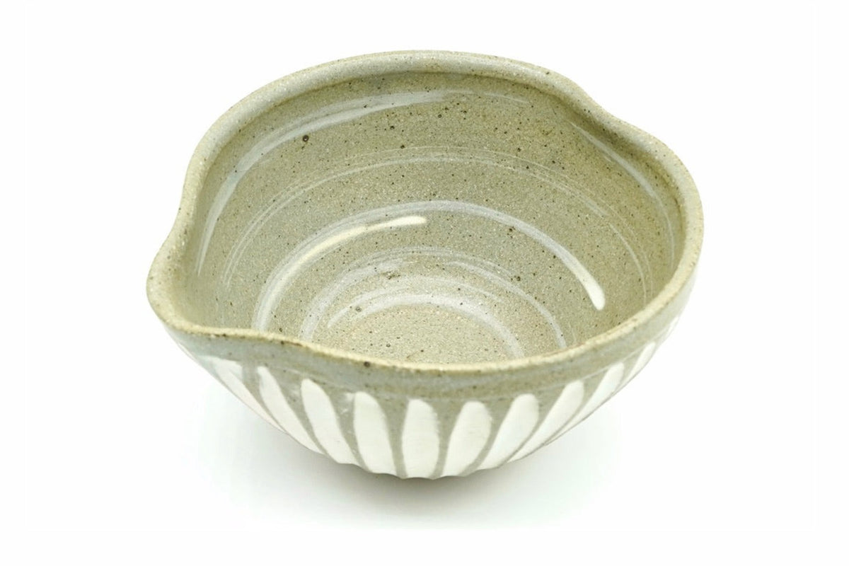 Shiro-Tokusa Katakuchi Chawan from above, white strokes swirling around the grey-green inside, the pouring lip on the left