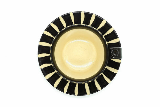 Sumi Yunomi from above, the glossy black inside of the cup on its striped saucer