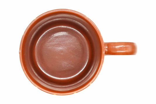 Tokusa Yunomi from above, the glossy red-brown inside and the loop handle on the right