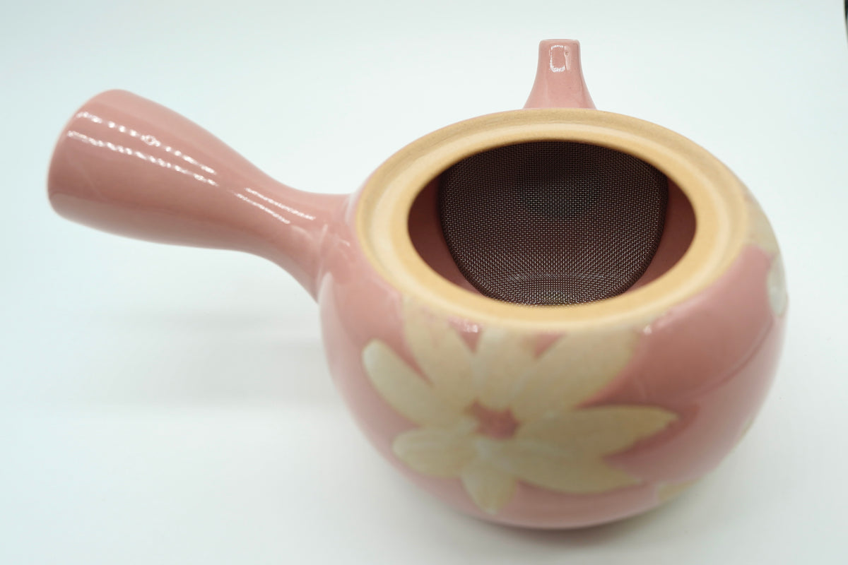Pink Shunbun Kyusu with the lid off, the curved stainless mesh over the spout opening inside