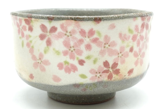 Harugasumi Yunomi, a speckled grey Mino ware teacup with a white panel of pink cherry blossoms