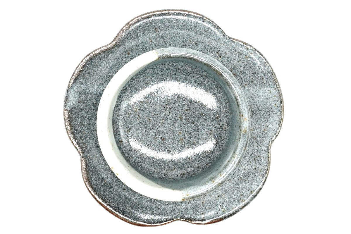 Tsukikage Yunomi flower-shaped saucer from above, blue-grey glaze with a brown edge and a raised centre ring for the cup