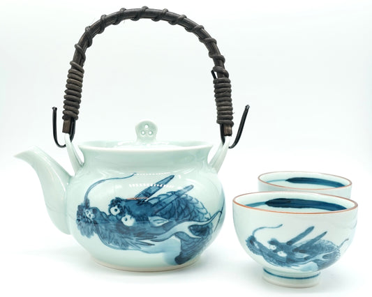Dragon Japanese Tea Set: a Hasami porcelain dobin teapot with a woven handle and two matching blue dragon teacups