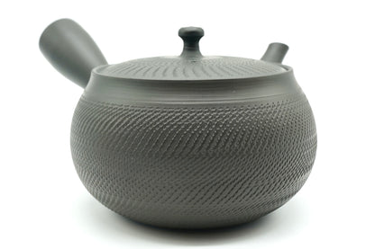Rikyu Nezumi kyusu from the other side, showing the side handle and the smooth band at the shoulder