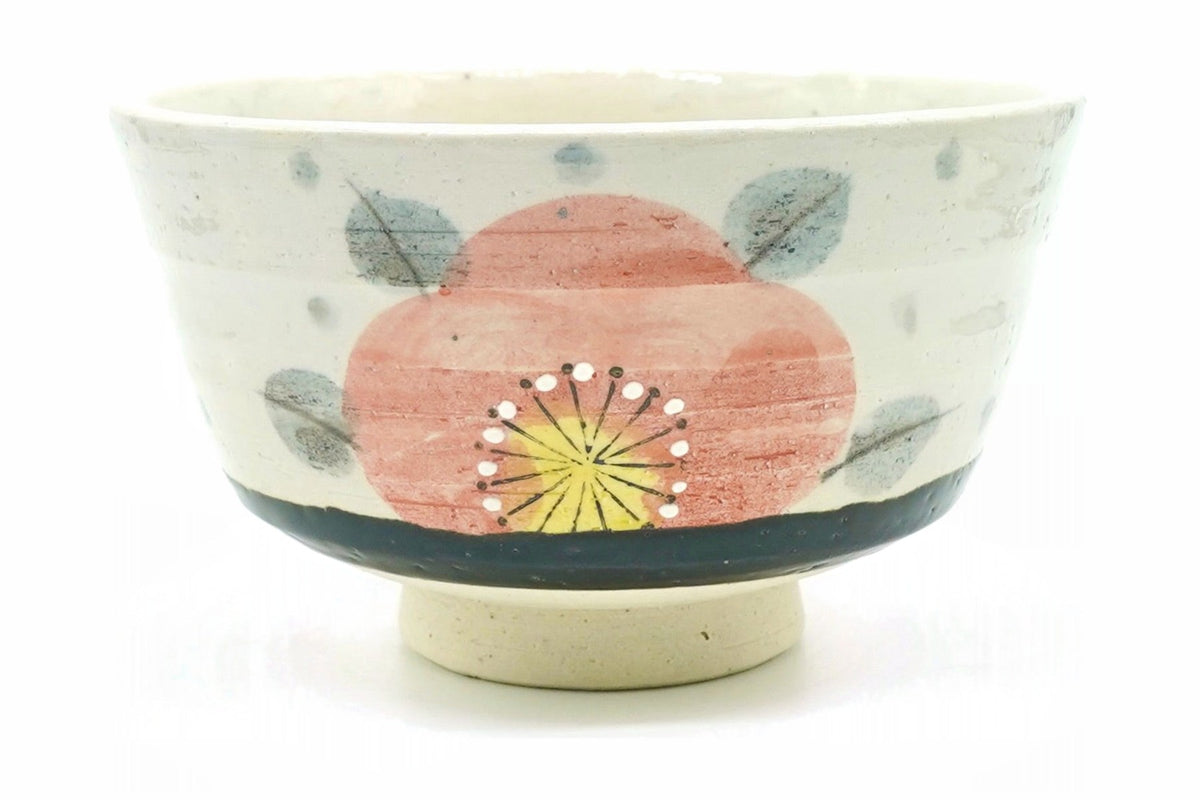 Aka-Tsubaki matcha bowl, cream with a large salmon-pink camellia, grey-blue leaves and a dark band above a bare cream foot