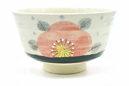 Aka-Tsubaki matcha bowl, cream with a large salmon-pink camellia, grey-blue leaves and a dark band above a bare cream foot