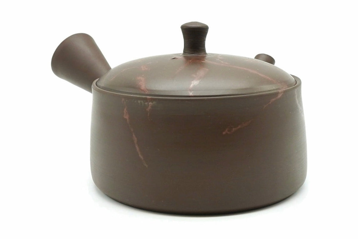 Akane-Shibori Kyusu from the back, the side handle on the left and pink-red veins across the lid and body