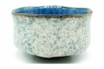 Ao-Ishi Chawan, a Mino ware matcha bowl with a rough white stone-like glaze flecked with blue, front view