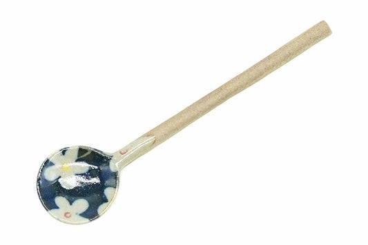 Aobana Ceramic Tea Spoon from above, the navy bowl with white blossoms and the long pale clay handle