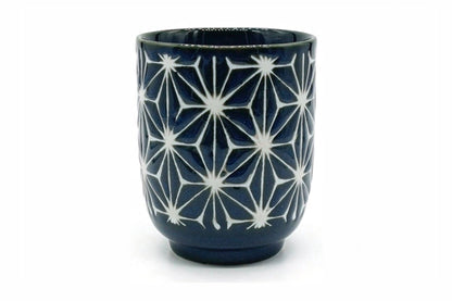 Asa Yunomi, a tall navy Mino ware teacup carved with a white six-pointed star pattern, front view