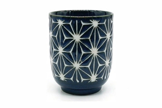 Asa Yunomi, a tall navy Mino ware teacup carved with a white six-pointed star pattern, front view