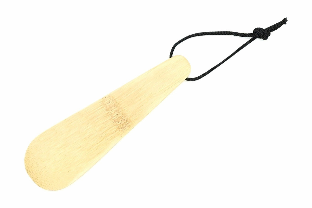 Bamboo Cha-saji from above, the flat tapered blade with the black cord loop knotted at the end