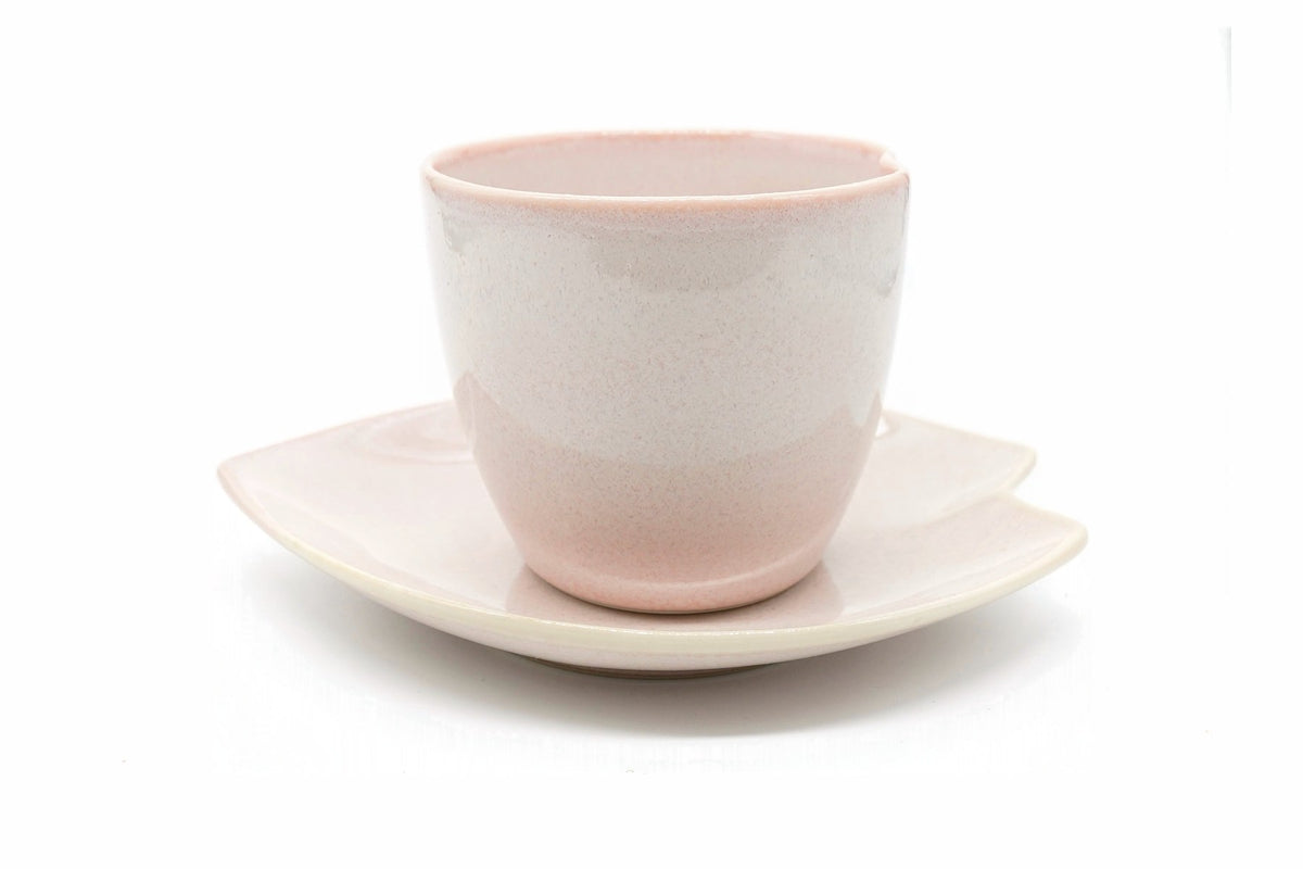 Beni-Sakura Yunomi, a pale pink Mino ware cup on a leaf-shaped saucer, front view