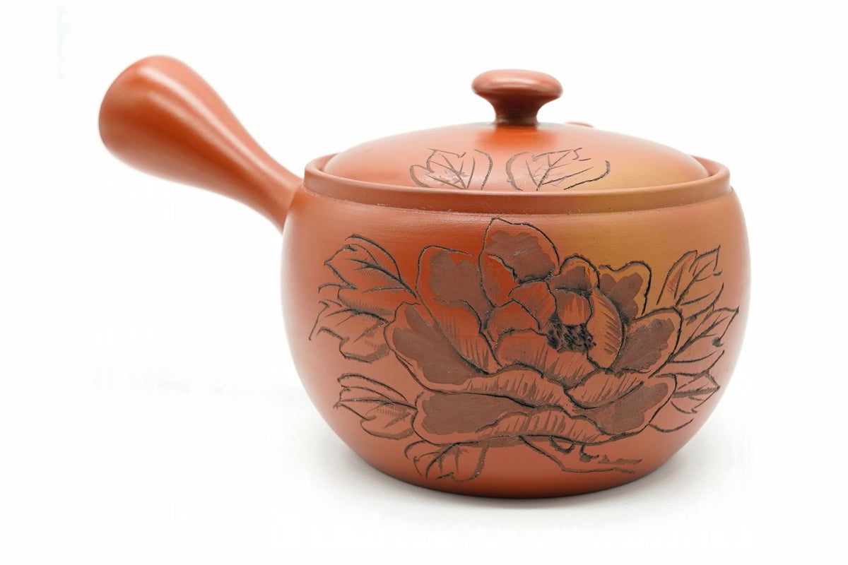 Botan Kyusu, a red shudei clay Tokoname teapot carved with a large peony, side view