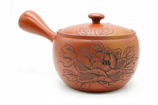Botan Kyusu, a red shudei clay Tokoname teapot carved with a large peony, side view