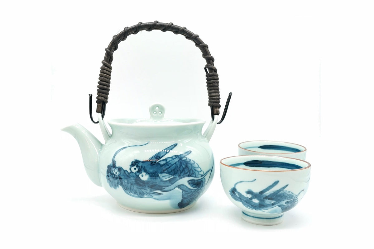 Dragon Japanese Tea Set: a Hasami porcelain dobin teapot with a woven handle and two matching blue dragon teacups