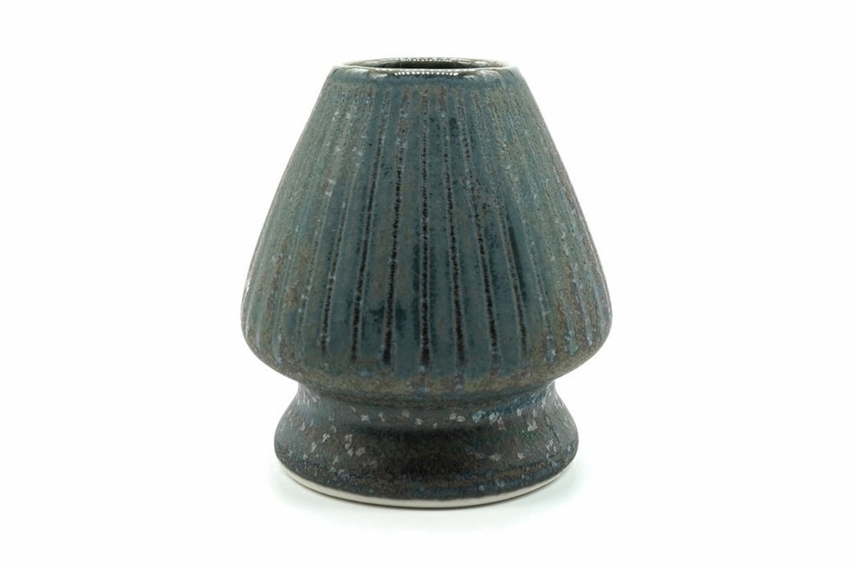 Gin Chasen Naoshi, Japanese matcha whisk holder, ribbed ceramic stand in a speckled blue-grey glaze, front view on white