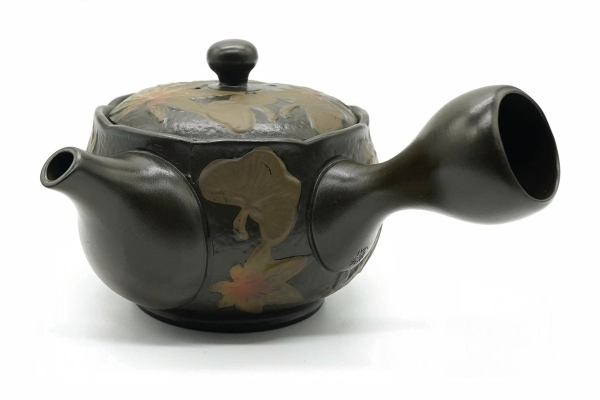 Ginnan Kyusu, a dark Tokoname teapot with ginkgo and maple leaves in relief, side view