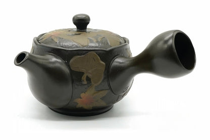 Ginnan Kyusu, a dark Tokoname teapot with ginkgo and maple leaves in relief, side view