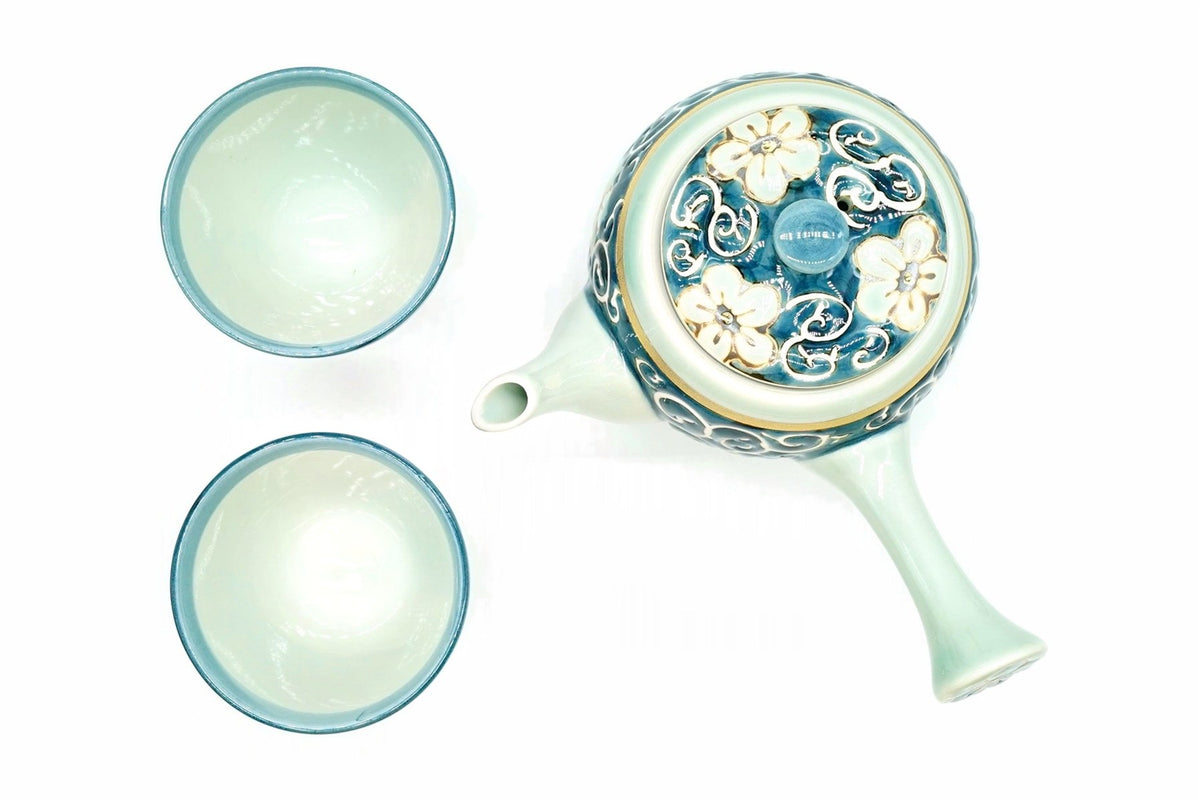 Hana-Karakusa Japanese Tea Set from above, the kyusu with flowers and scrolls on its lid and the two cups, pale blue-green inside