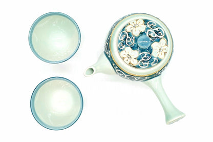 Hana-Karakusa Japanese Tea Set from above, the kyusu with flowers and scrolls on its lid and the two cups, pale blue-green inside