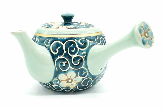 Hana-Karakusa Kyusu, a side-handle teapot in blue with white scrolls and pale flowers, a pale blue-green spout and handle and a thin gold-coloured band