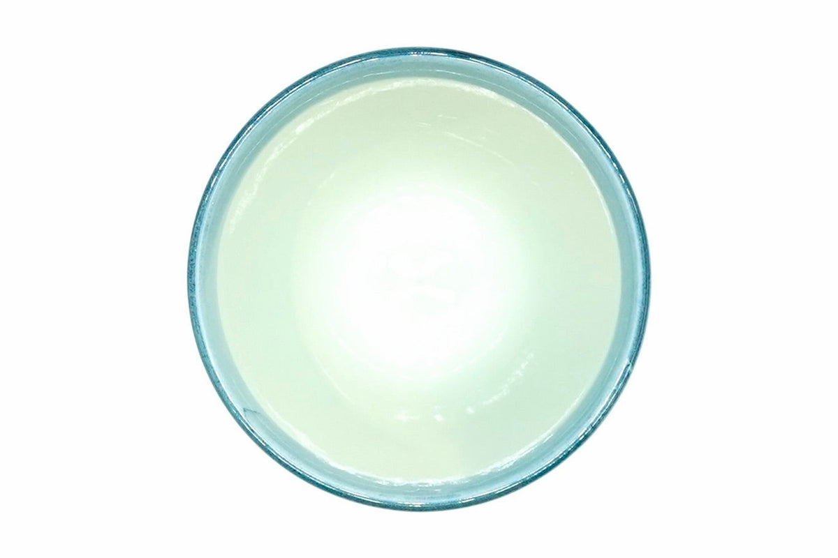 Hana-Karakusa Yunomi from above, pale blue-green inside with a blue rim
