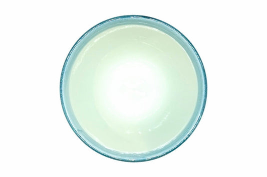 Hana-Karakusa Yunomi from above, pale blue-green inside with a blue rim