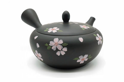 Hanafubuki Kyusu, a black Tokoname teapot hand-painted with pink cherry blossoms and petals, front view