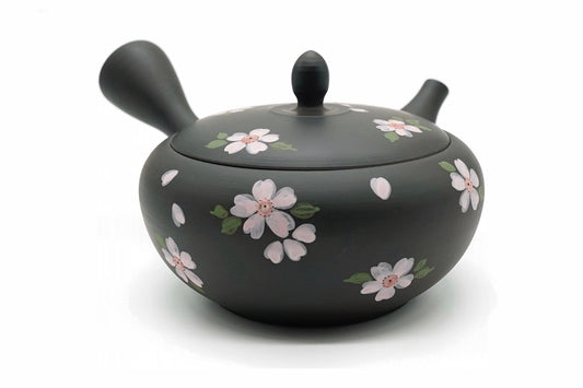 Hanafubuki Kyusu, a black Tokoname teapot hand-painted with pink cherry blossoms and petals, front view