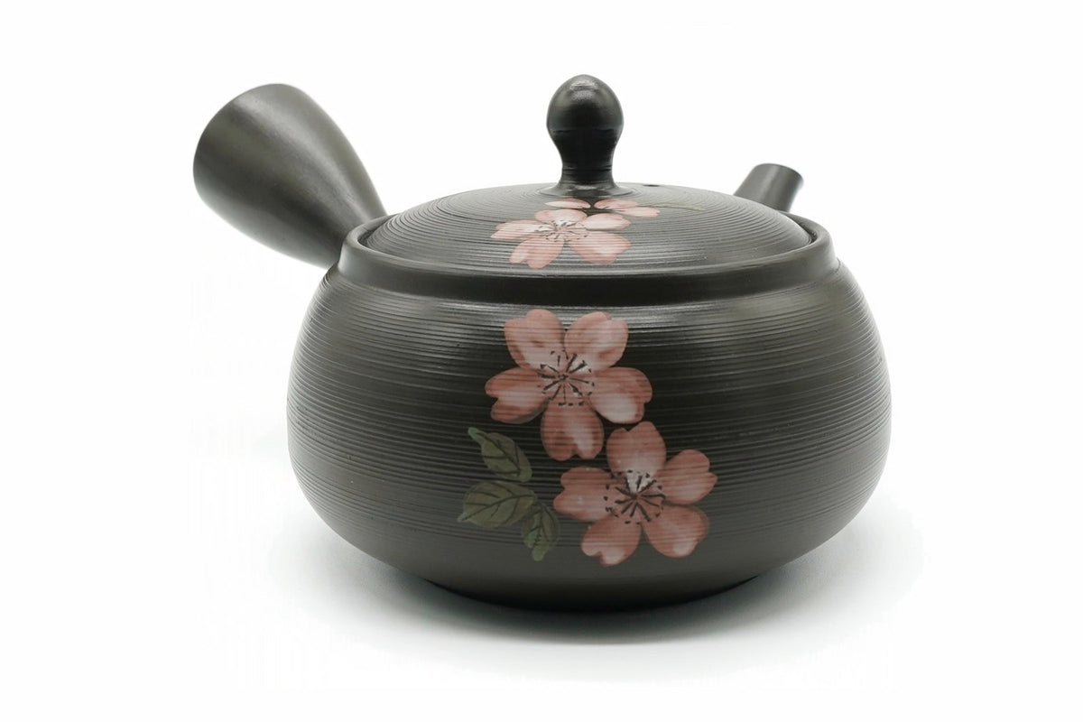 Hanami Kyusu, a dark combed Tokoname teapot hand-painted with pink cherry blossoms, front view