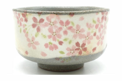 Harugasumi Yunomi, a speckled grey Mino ware teacup with a white panel of pink cherry blossoms