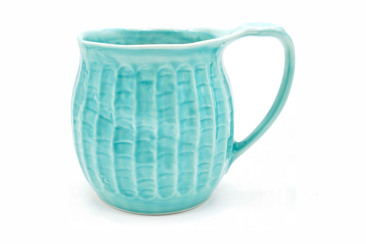 Jōmon 1 Yunomi, a big turquoise Mino ware mug with rows of cord-like impressions, front view