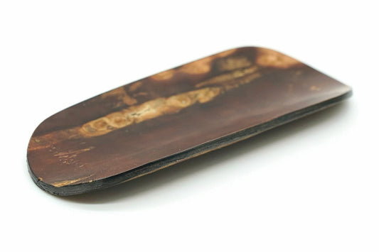 Kabazaiku tea scoop, a flat scoop in polished wild cherry bark with a mottled grain
