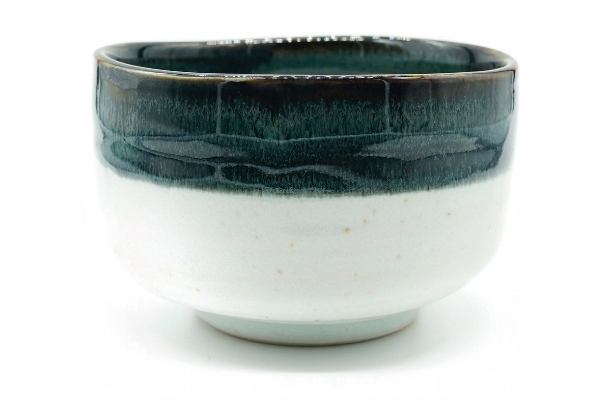 Kara-Tōge Chawan, a Mino ware matcha bowl with a deep blue-black glaze over a chalky white body, front view