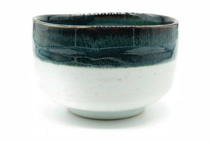 Kara-Tōge Chawan, a Mino ware matcha bowl with a deep blue-black glaze over a chalky white body, front view