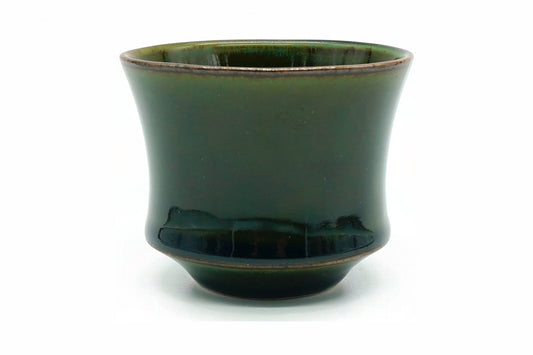 Koke Yunomi, a deep glossy moss-green Mino ware teacup flaring from a stepped foot, front view