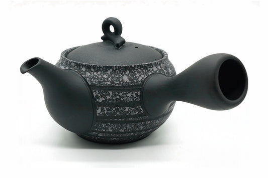 Kokudei Kyusu, a black Tokoname teapot with bands of grey speckle like granite and a ring knob, side view