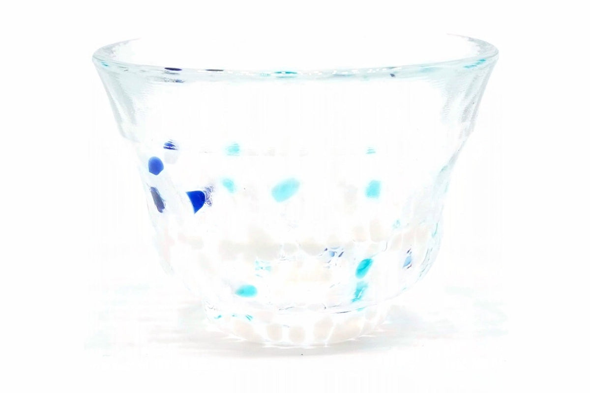 Konayuki Glass Choko, a small flared glass cup on a short foot, clear glass flecked with deep blue, turquoise and white