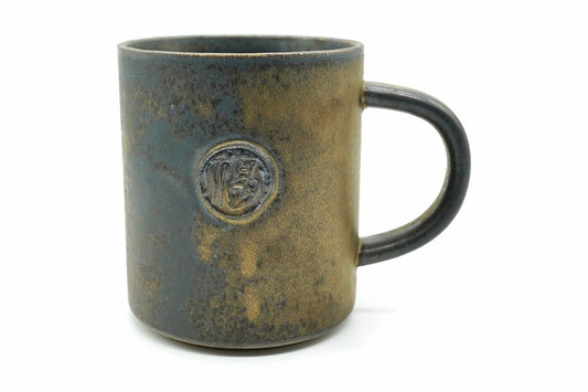 Kotto Yunomi, a tall Mino ware mug in a mottled bronze-gold and dark green glaze with a stamped seal, front view