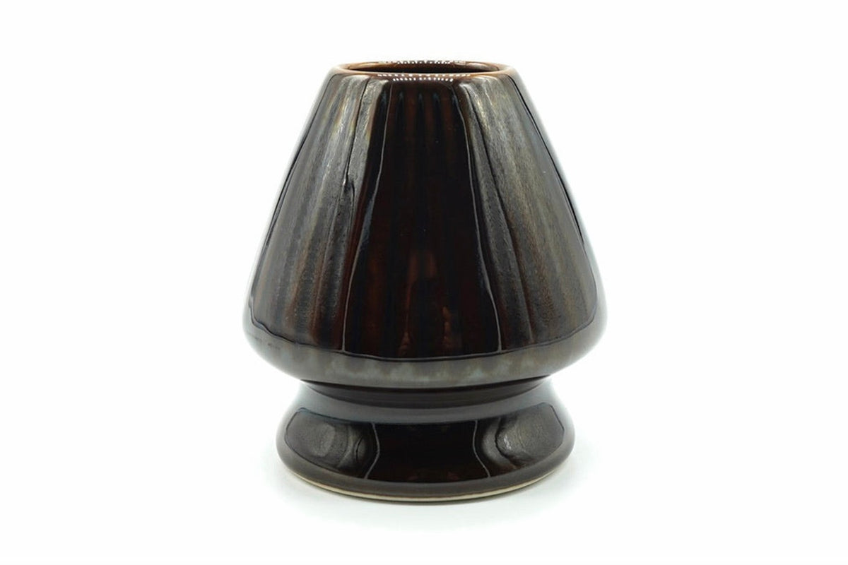 Kurage Chasen Naoshi, Japanese matcha whisk holder, ribbed ceramic stand in a dark glossy brown-black glaze, front view on white