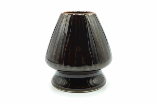 Kurage Chasen Naoshi, Japanese matcha whisk holder, ribbed ceramic stand in a dark glossy brown-black glaze, front view on white