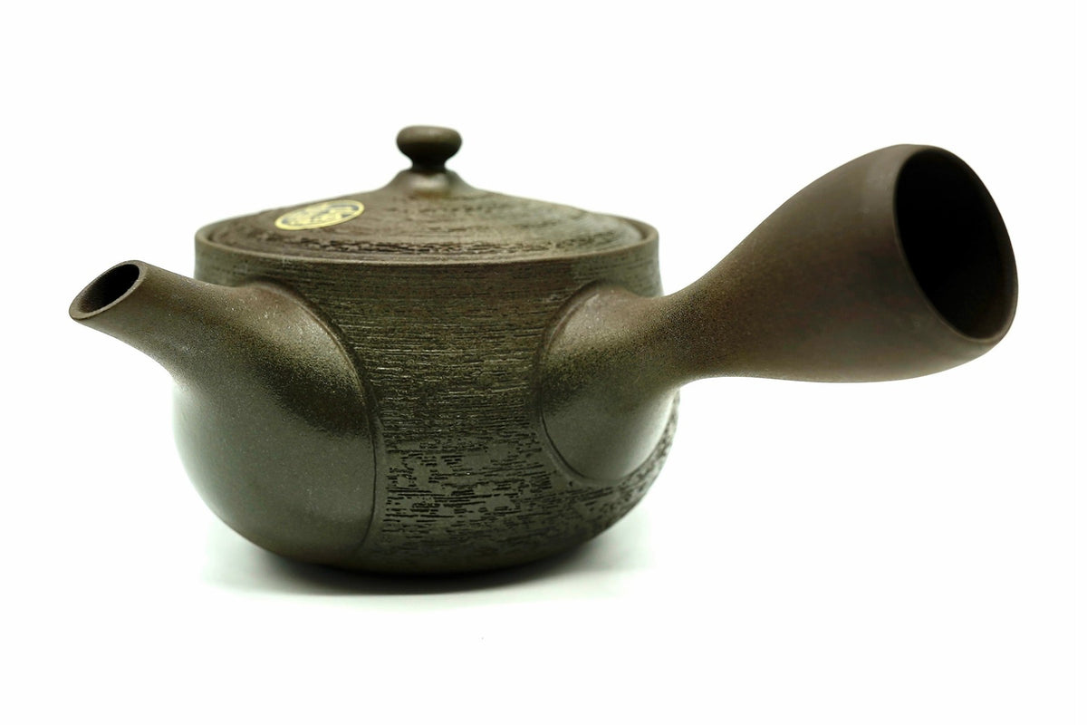 Kuri Kyusu, a chestnut-brown Tokoname teapot with a fine combed texture, side view