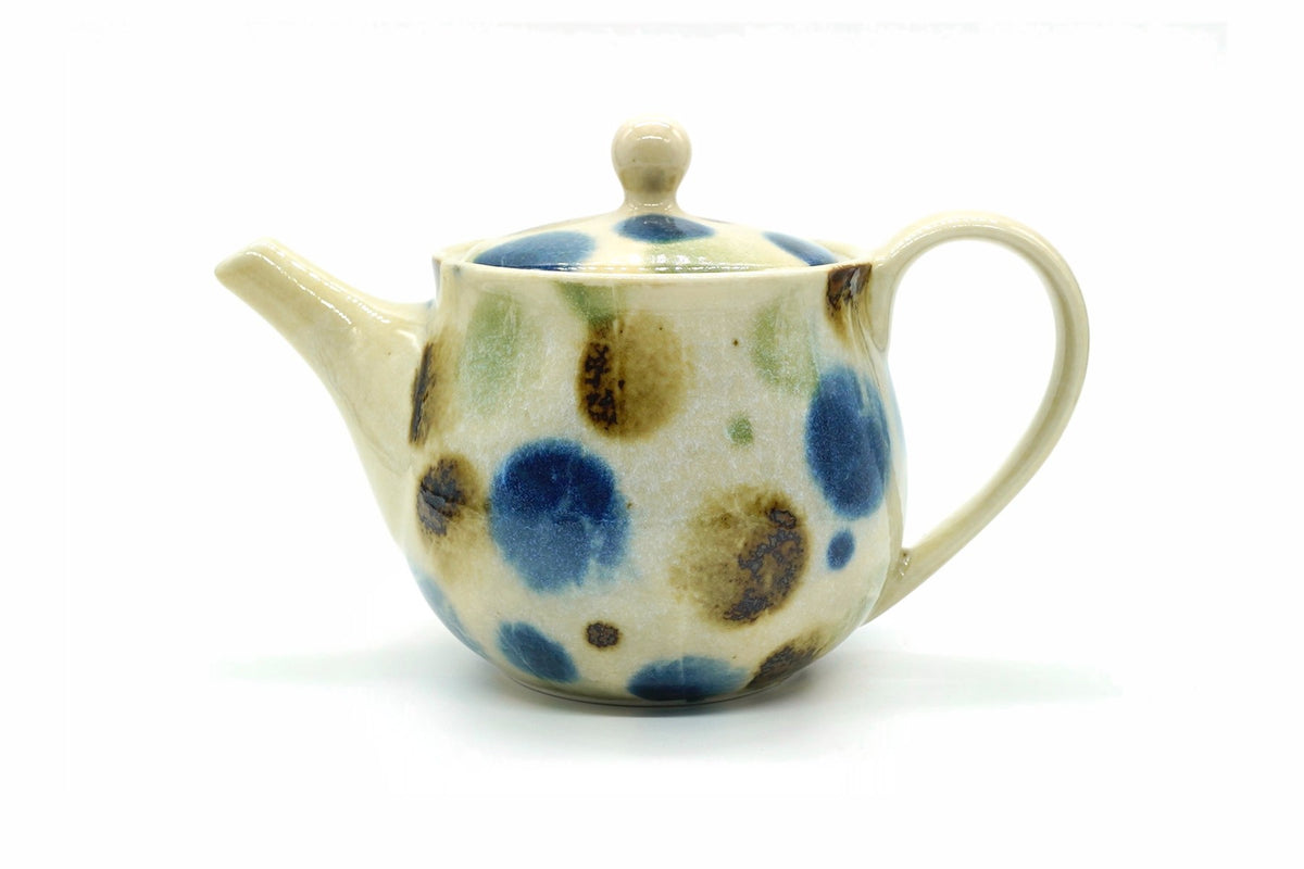 Mizutama Kyusu, a cream Tokoname teapot with large blue, brown and green polka dots and a loop handle at the back
