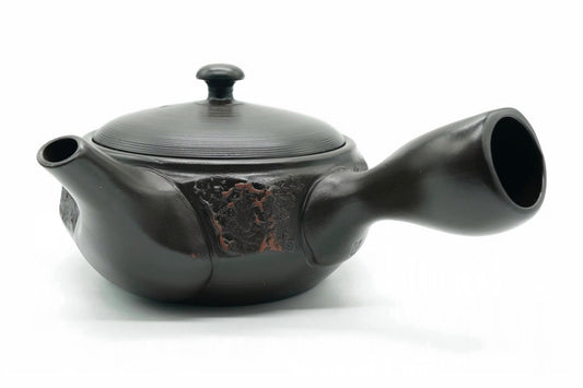 Mokume Kyusu, a dark Tokoname teapot with a rough red-brown panel and a red-tipped knob, side view