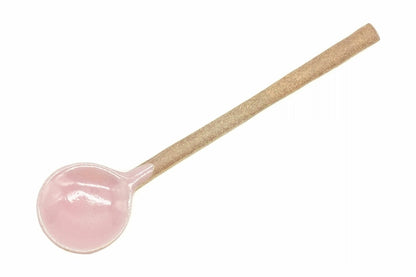 Momo Ceramic Tea Spoon from above, the round pink glazed bowl and the long clay handle