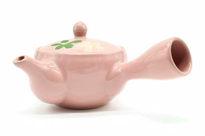 Momoiro Kyusu, a small peach-pink teapot with white flowers painted on the lid, side view